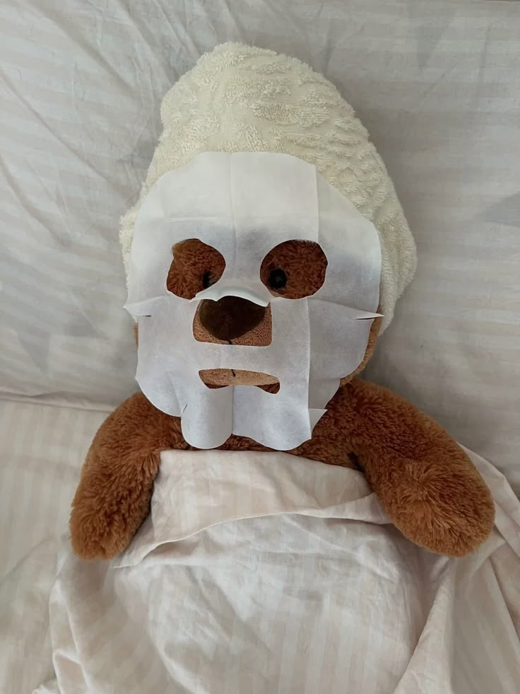 A teddy bear having a cozy self-care night